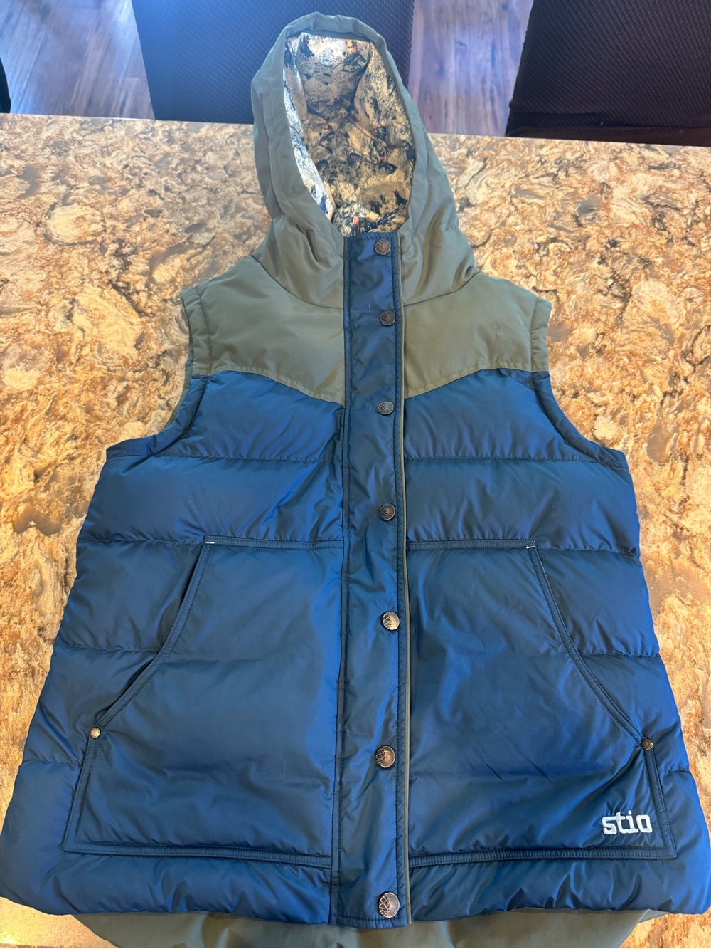 Stio women’s Blue and Olive Insulated Hooded Vest